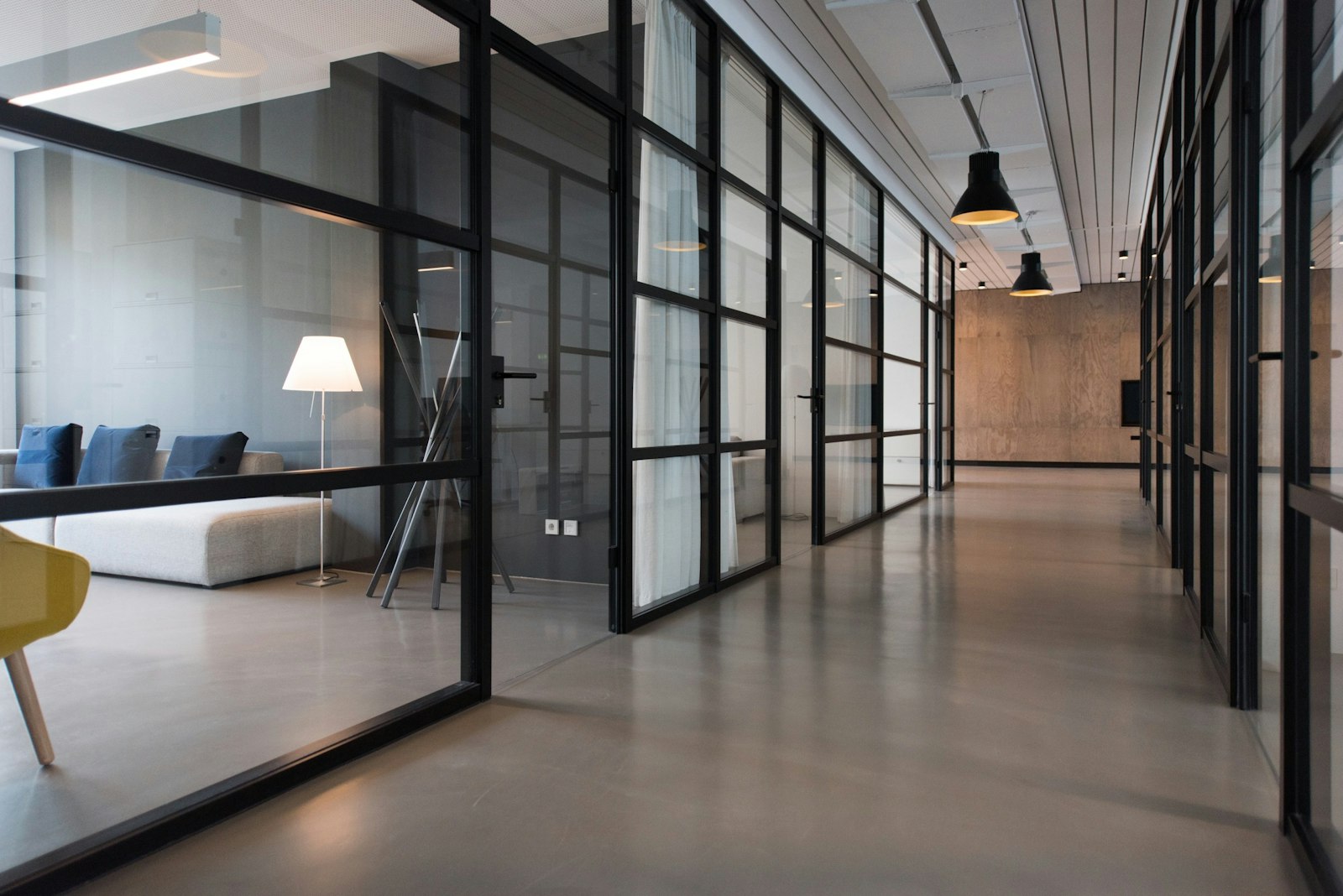 Modern small office with glass-walled rooms