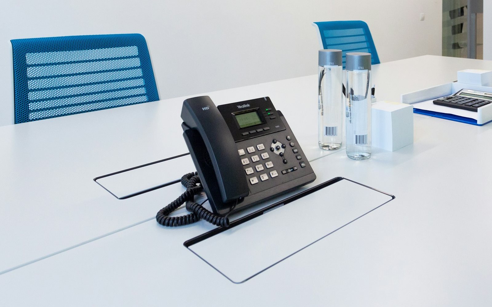 Yealink IP desk phone on a conference table